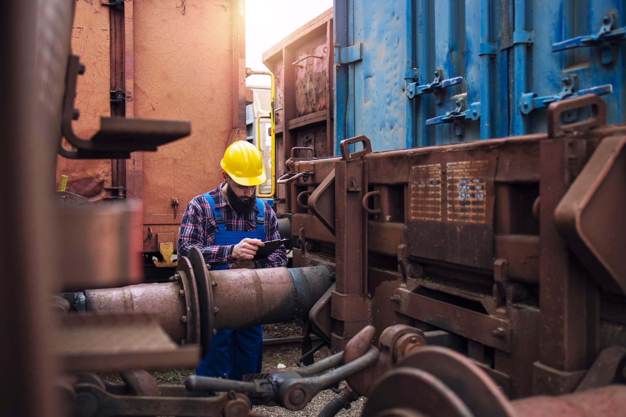 Engineer inspecting a high-pressure boiler system
